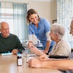 nurse-giving-medicine-to-seniors